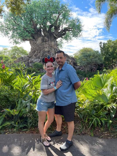 Amy Reale, Travel Agent at Favorite Grampy Travels, and her family at Animal Kingdom, Walt Disney World, in front of the Tree of Life