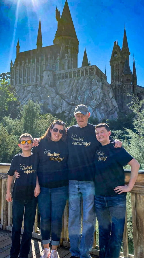 Heather Pichardo's Family standing in front of Hogwarts in Universal Studios Orlando Florida Favorite Grampy Travels 2