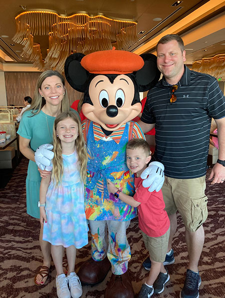 Stacey Bailey and Family with Mickey Mouse at Walt Disney World - Favorite Grampy Travels