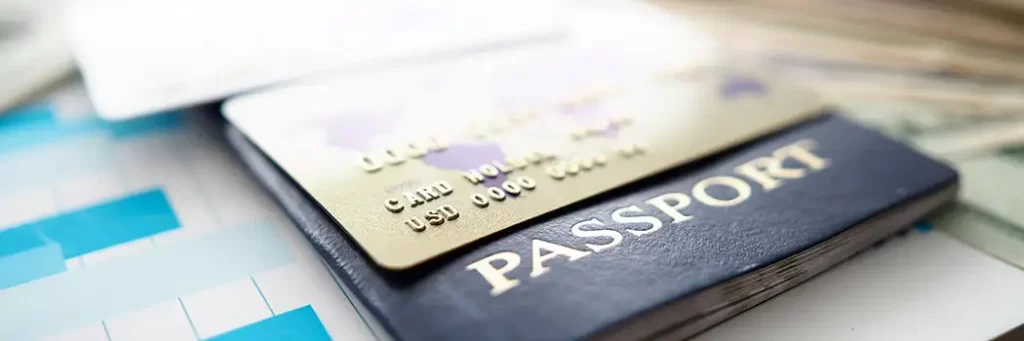 Credit card and passport getting ready to apply ETIAS Travel Authorization for Europe