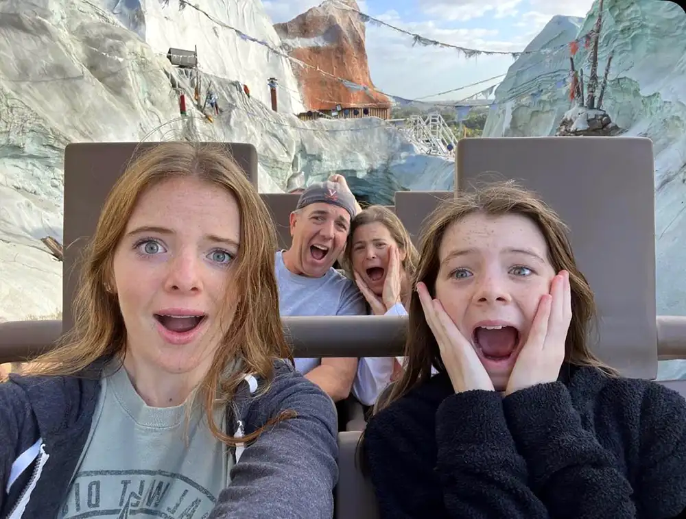Laura Donovan at Walt Disney World on Expedition Everest rollercoaster with her family. They look scared.