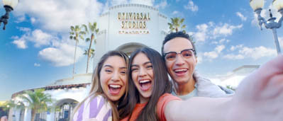 Three people waiting to buy tickets for Universal Studios Hollywood