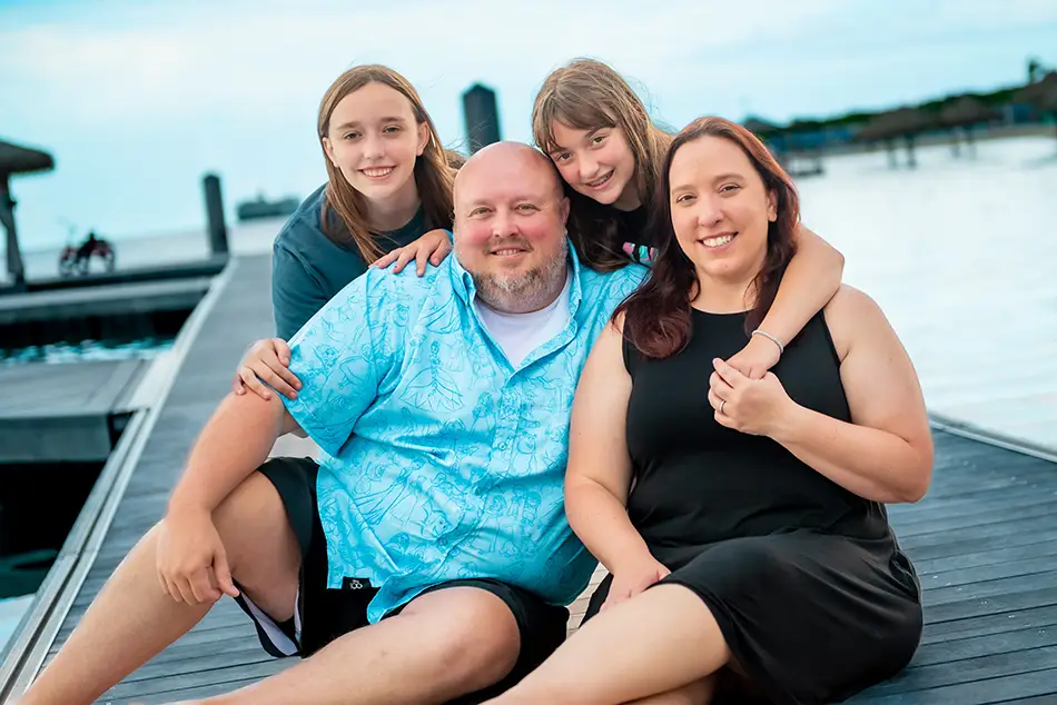 Favorite Grampy Travels Travel Agent Angie Dodd with Family by Water - Favorite Grampy Travels 2026