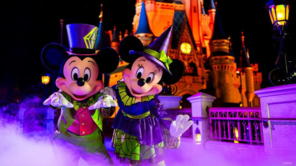 Mickeys Not So Scary Halloween Party-Mickey and Minnie Halloween in front of Castle