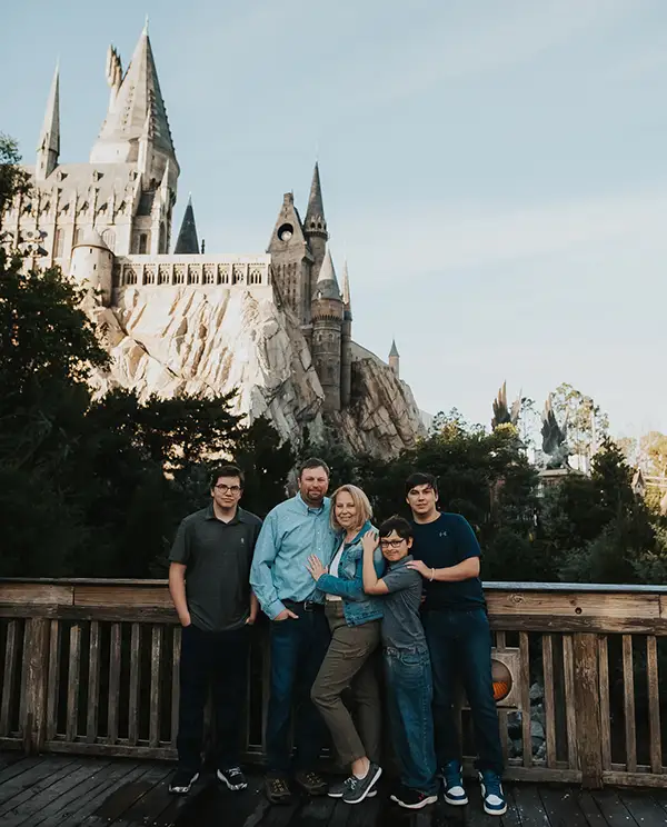 Holly Neth and Family at Universal Studios with Hogwarts in the background