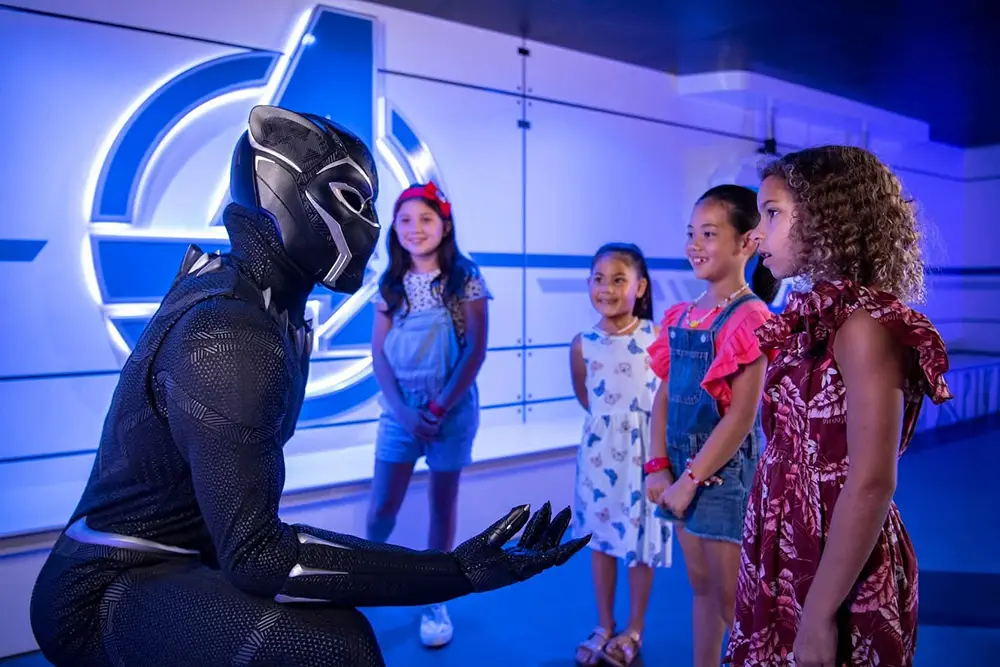 Black Panther meets children in the Marvel Super Hero Academy inside Disney's Oceaneer Club, the included kids club for ages 3 to 10 on Disney Cruise Line - Favorite Grampy Travels