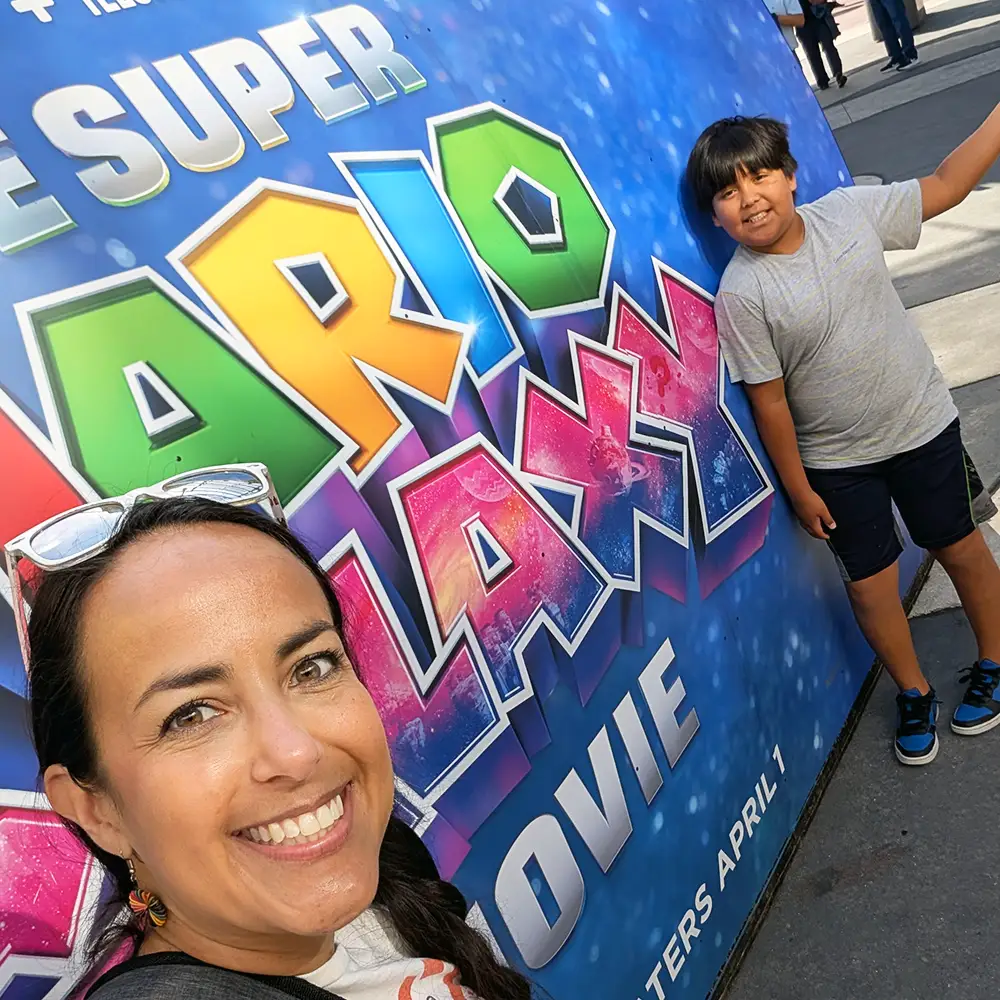 Family Posing with the Super Mario Galaxy Movie Display at Universal Cinemark at Citywalk on Opening Day April 2026 - Favorite Grampy Travels