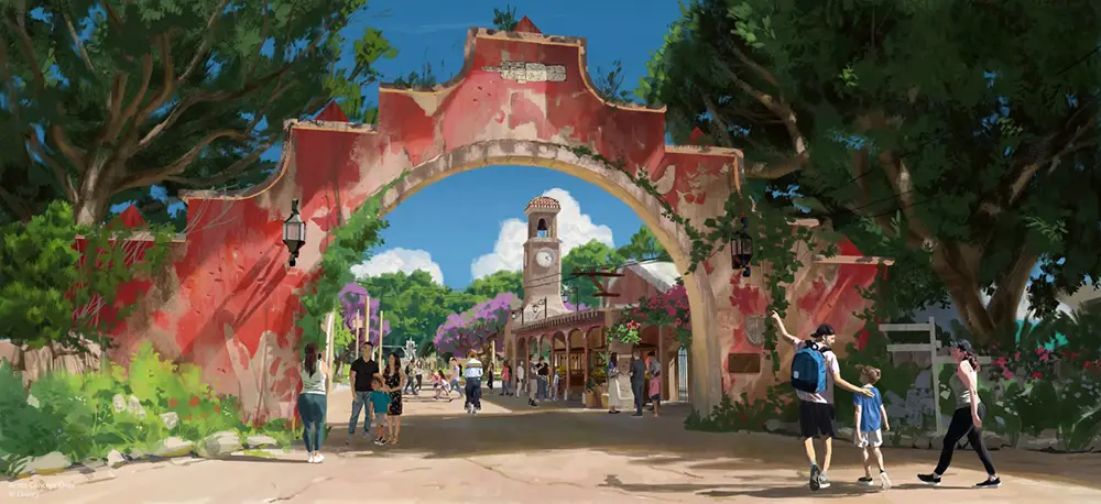 People Stroll Under a Large, Weathered Red Archway Surrounded by Trees, Entering the Lively Tropical Americas Plaza in Disney’s Animal Kingdom, with a Central Clock Tower and Shops Beneath a Bright Blue Sky Dotted with Fluffy Clouds. - Favorite Grampy Travels - Favorite Grampy Travels 2026