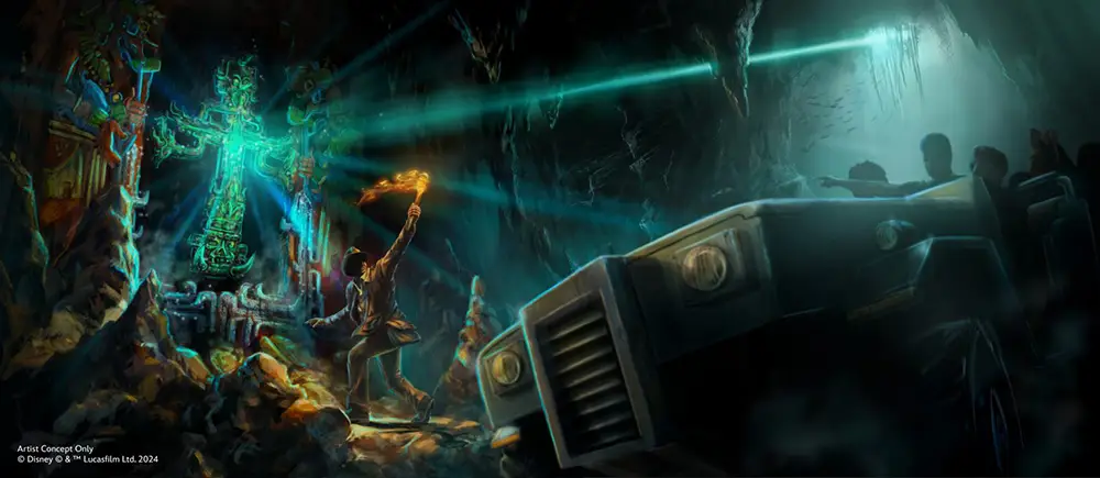 an Explorer Holding a Torch Faces a Glowing, Ancient Statue Inside a Dark Cave, While a Group from Disney’s Animal Kingdom Watches from Their Rugged Vehicle As Beams of Blue Light Shoot from the Statue and Illuminate the Cavern in the Tropical Americas. - Favorite Grampy Travels - Favorite Grampy Travels 2026