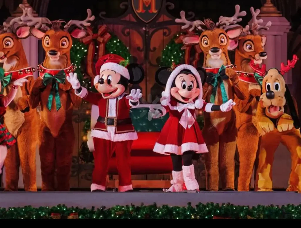 Mickey and Minnie Mouse in Christmas Outfits Stand with Reindeer and Pluto on the Festive Cinderella Stage Decorated with Lights and Holiday Greenery at Magic Kingdom for Mickey's Very Merry Christmas Party. - Favorite Grampy Travels - Favorite Grampy Travels 2026 - Favorite Grampy Travels 2026