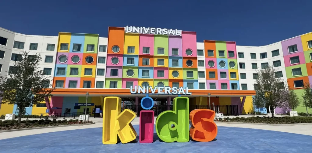 a Colorful Building with a Variety of Square and Circular Windows, Featuring Large, Playful 3d Letters in Front That Spell Universal Kids Under a Clear Blue Sky. - Favorite Grampy Travels - Favorite Grampy Travels 2026
