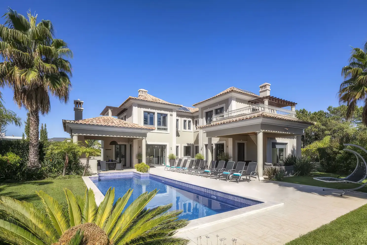 A private villa in Europe with a pool and terrace seating, one of the properties in the collection