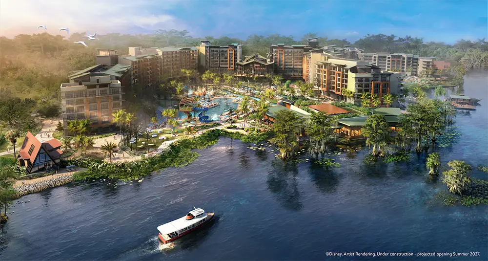 Aerial view of a large lakeside resort with several buildings, pools, greenery, a dock, and a boat on the water; people are enjoying the outdoor areas under a clear sky. - Favorite Grampy Travels