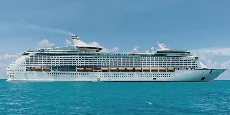 a Large White Cruise Ship with Multiple Decks Sails on Calm Blue Water Under a Clear Sky. - Favorite Grampy Travels 2026 - Favorite Grampy Travels 2026