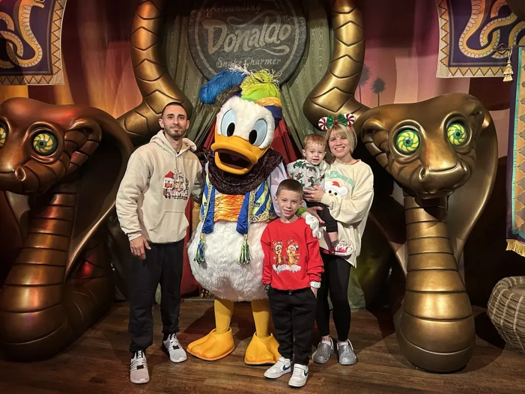 Korrine Ferrari and her family meeting Donald Duck at Walt Disney World