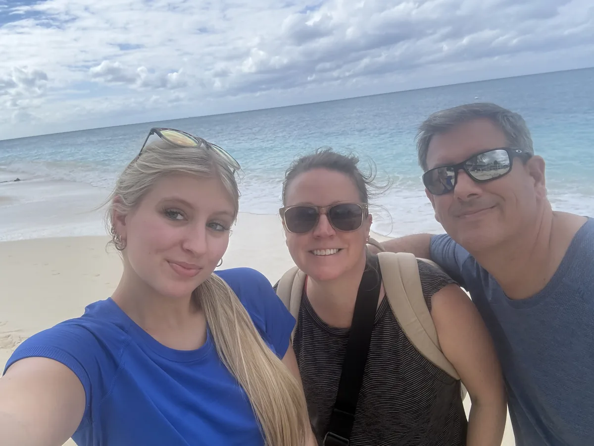 Vicki Kopidlansky with her family on a Caribbean beach