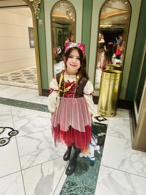Avilene in a pirate costume and bandana for Pirate Night on a Disney cruise