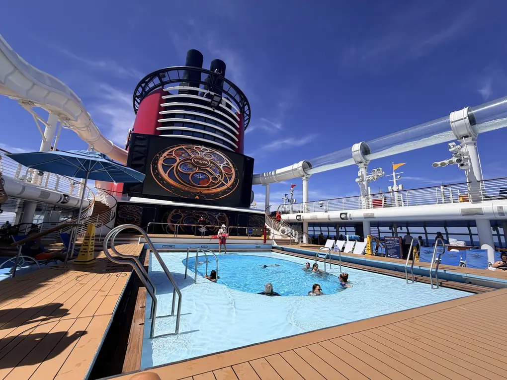 The pool deck and AquaDuck water coaster on the Disney Dream on a sunny sea day