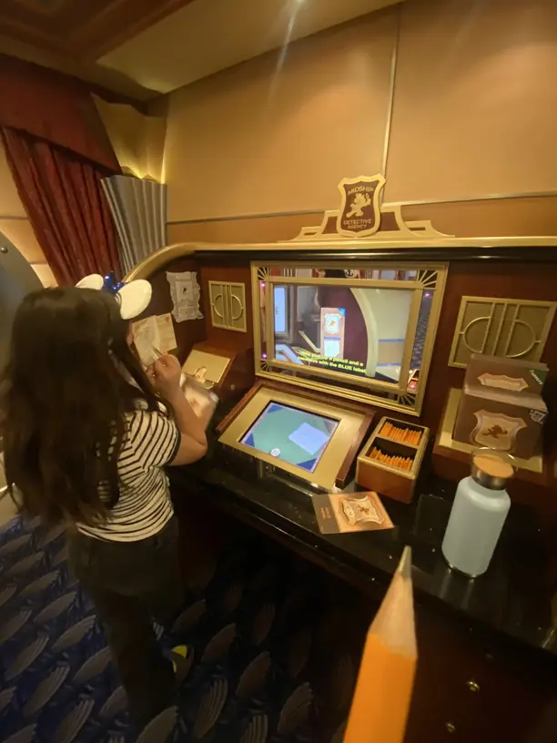 Avilene solving a case at a Midship Detective Agency screen on the Disney Dream