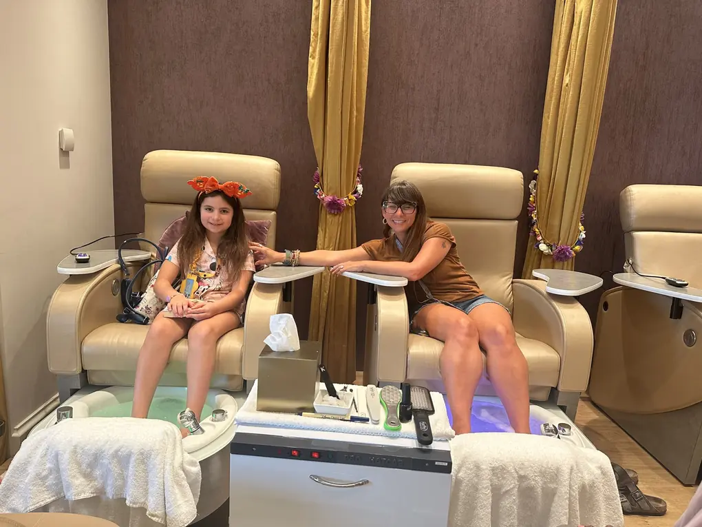 Nicole and Avilene getting pedicures together at the spa on a Disney cruise