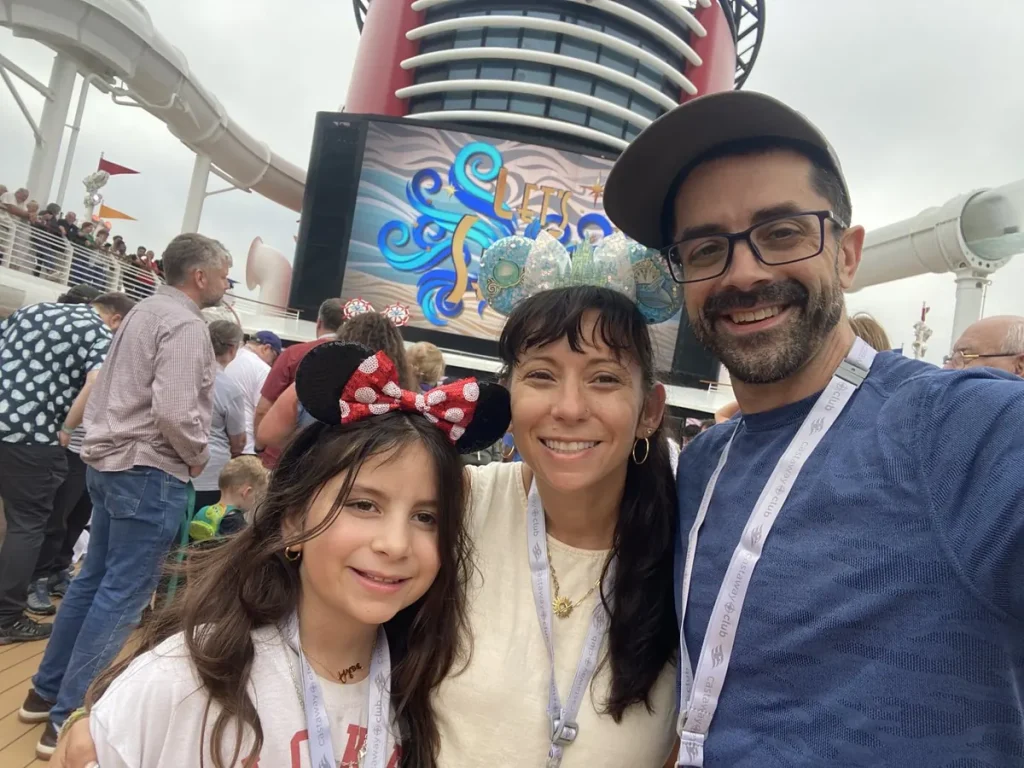 Nicole, Adam and Avilene in Mickey ears at the sail away party on the Disney Dream