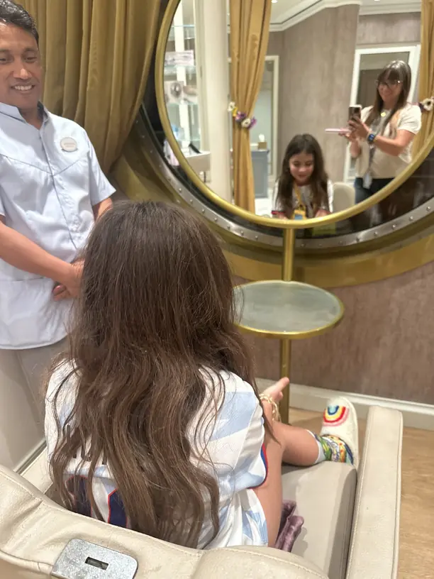 Avilene getting her hair done at the onboard salon on a Disney cruise