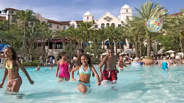 A family splashes through the shallow end of the pool at Hard Rock Hotel at Universal Orlando Resort