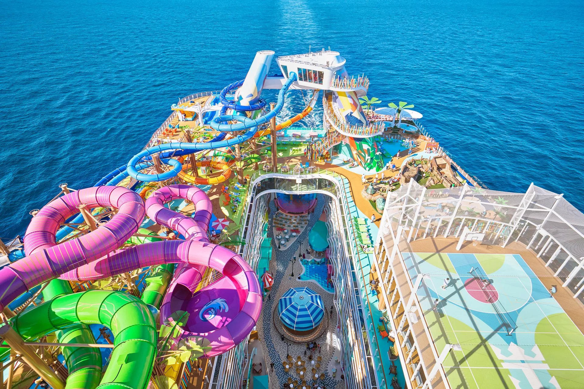 Aerial view of the back of Icon of the Seas showing the Category 6 waterslides above Surfside