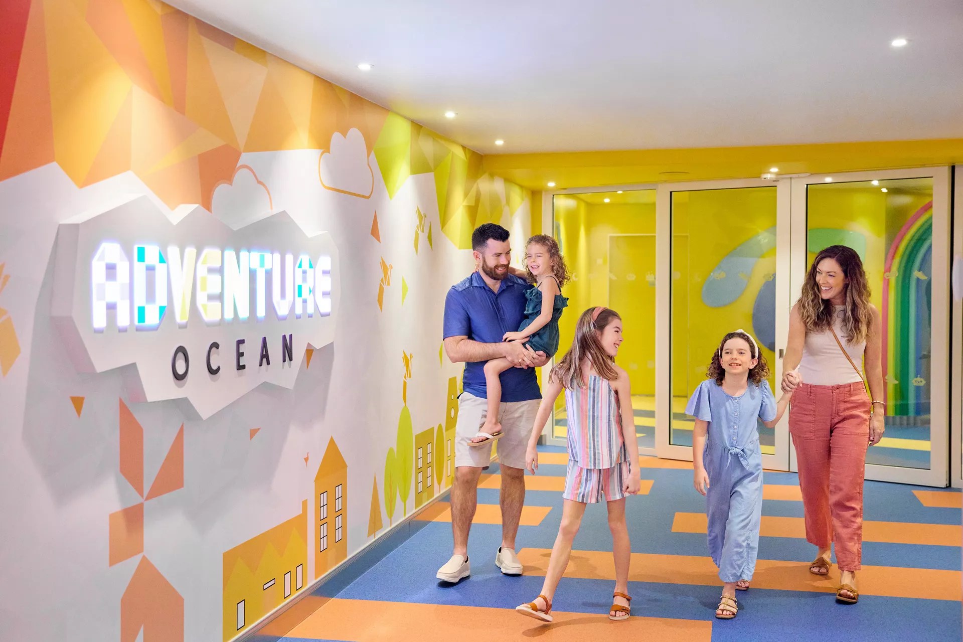 Family walking into the Adventure Ocean kids club on Icon of the Seas