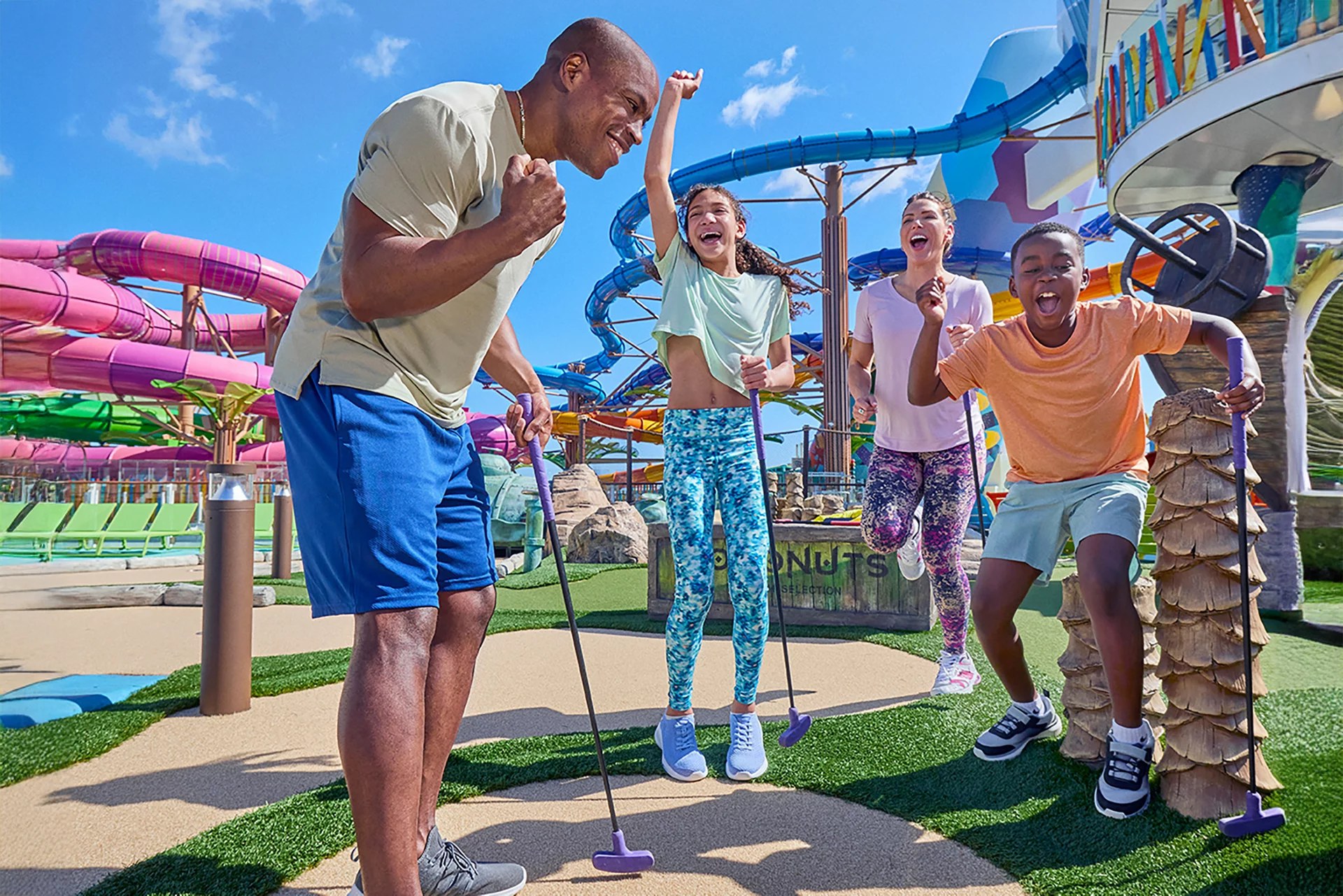 Family playing Lost Dunes mini golf on Icon of the Seas