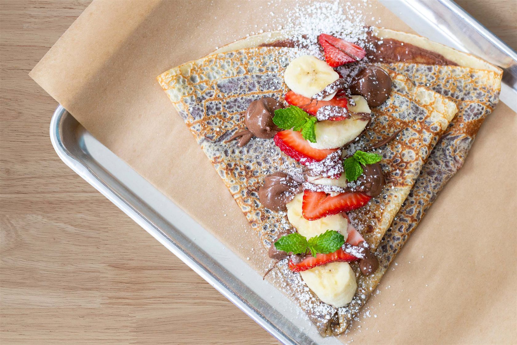 Hazelnut and banana crepe with strawberries from the AquaDome Market on Icon of the Seas