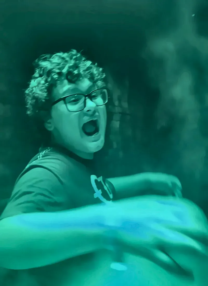Holly Neth Son Screaming with Joy in Diagon Alley at Halloween Horror Nights - Favorite Grampy Travels - Favorite Grampy Travels Holly Neth's son screaming with delight in green light in Diagon Alley at Universal Studios Florida during Halloween Horror Nights.