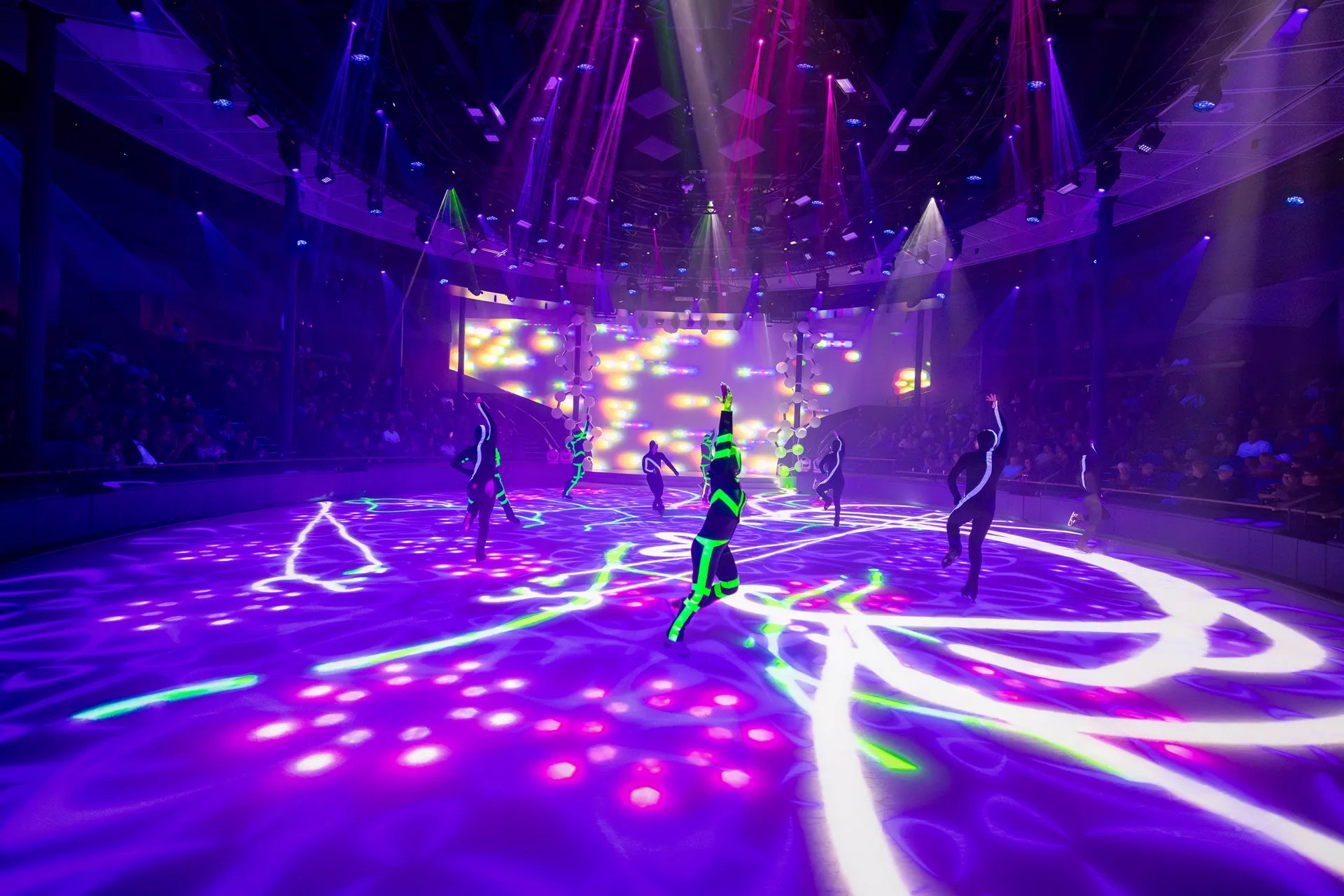Skaters performing an ice show at Absolute Zero on Icon of the Seas