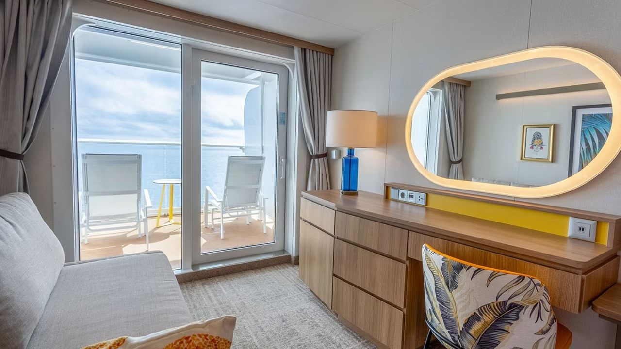 Living area in an Icon of the Seas Large Balcony stateroom