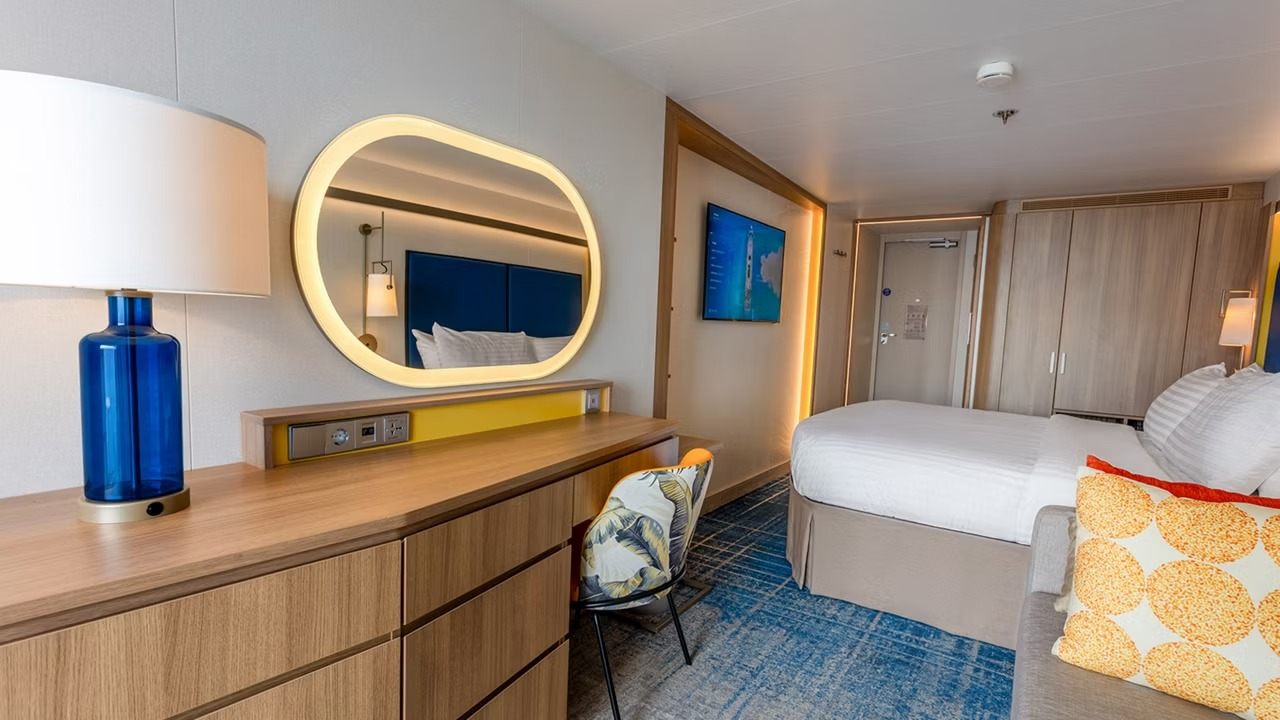 Bed in an Icon of the Seas Large Balcony stateroom