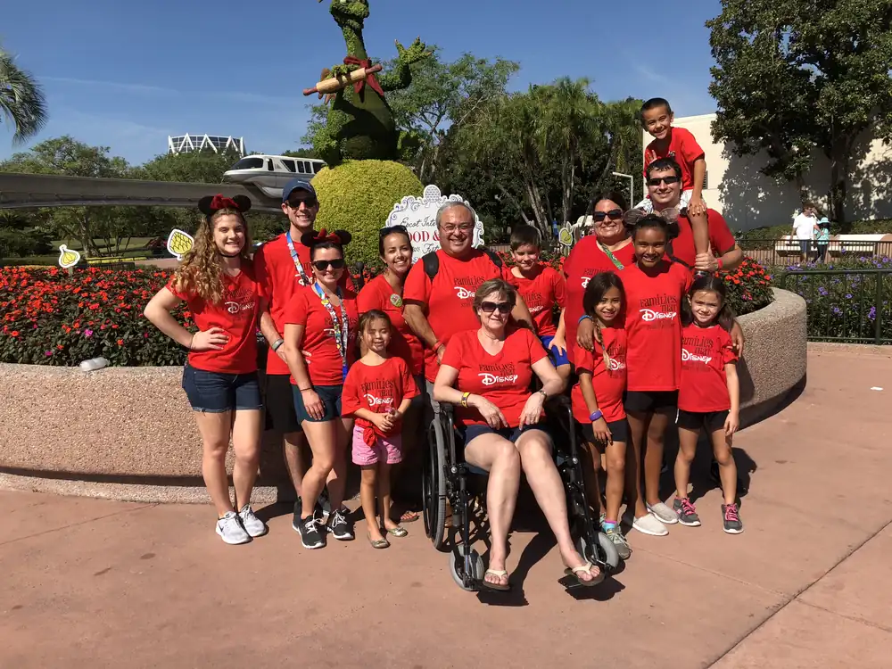 Large multigenerational family in matching red shirts at EPCOT