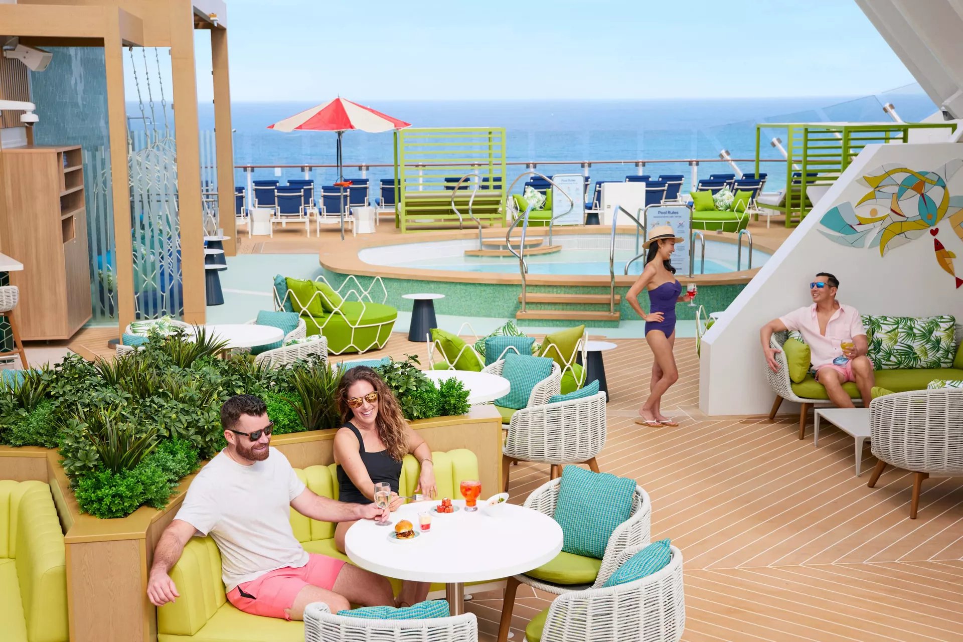 Suite guests having lunch by the pool on The Grove Suite Sun Deck on Icon of the Seas