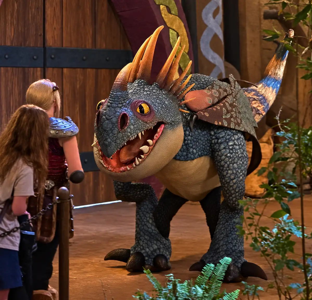 A dragon meet and greet in Isle of Berk during Universal Nights at Epic Universe