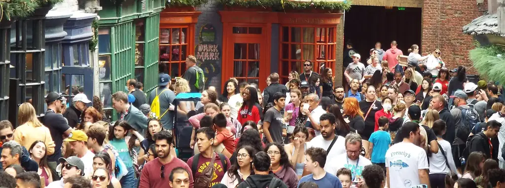 Crowds pack Diagon Alley at Universal Studios Florida right after park opening outside Weasleys Wizard Wheezes. - Favorite Grampy Travels