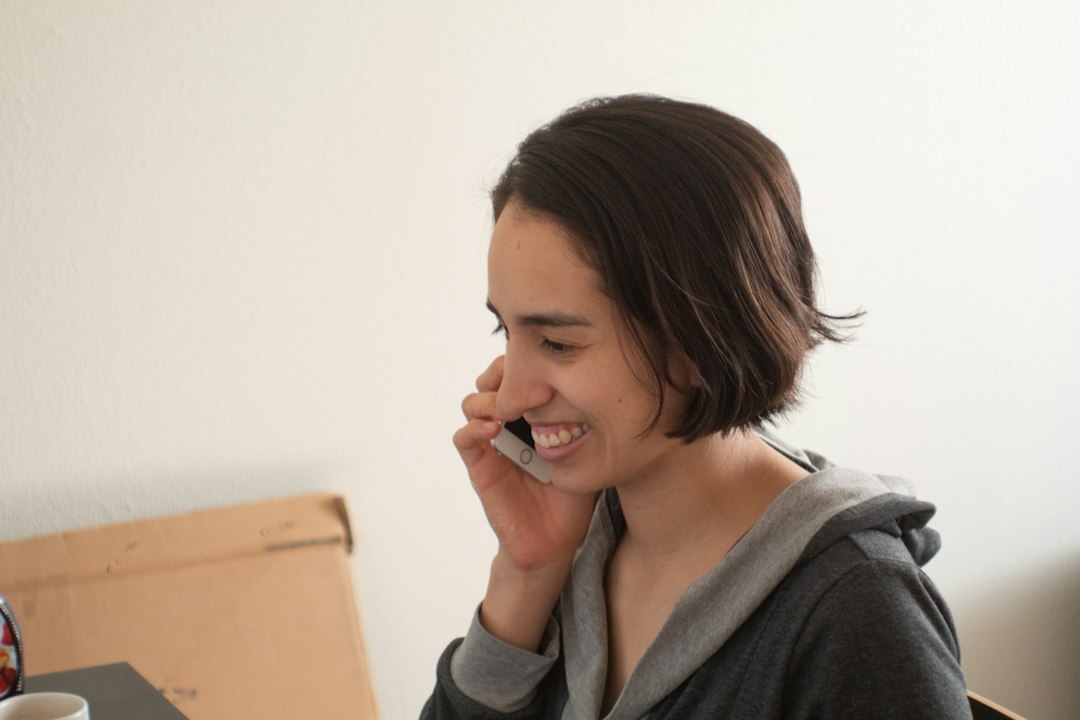 Parent on a phone call with a travel advisor during a complimentary consultation